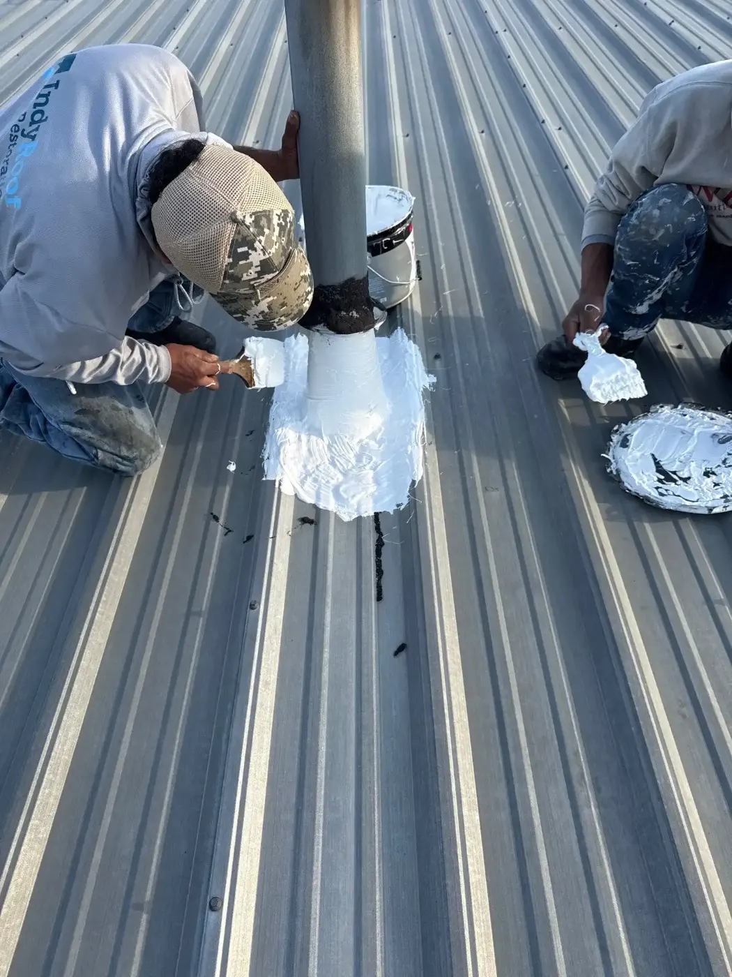 Tarping and dry-in on a Sheridan commercial roof
